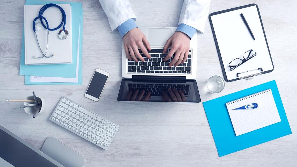 Office workspace with computer and coffee